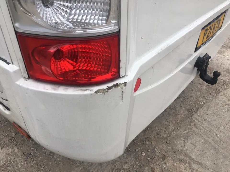 Campervan fibreglass bumper damage before repair at OH Works in Fairford