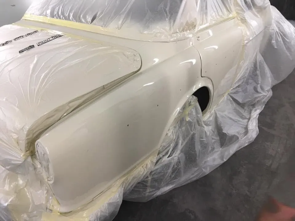 Classic Volvo Amazon rear wing resprayed cream in the spray booth at OH Works