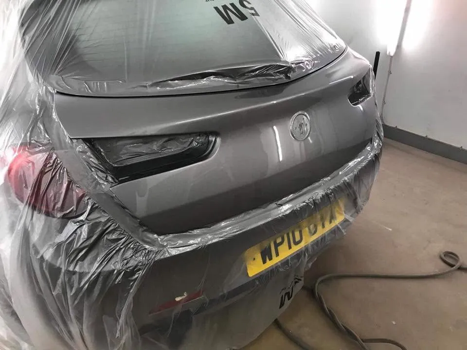 Grey Vauxhall rear masked and resprayed in the spray booth at OH Works