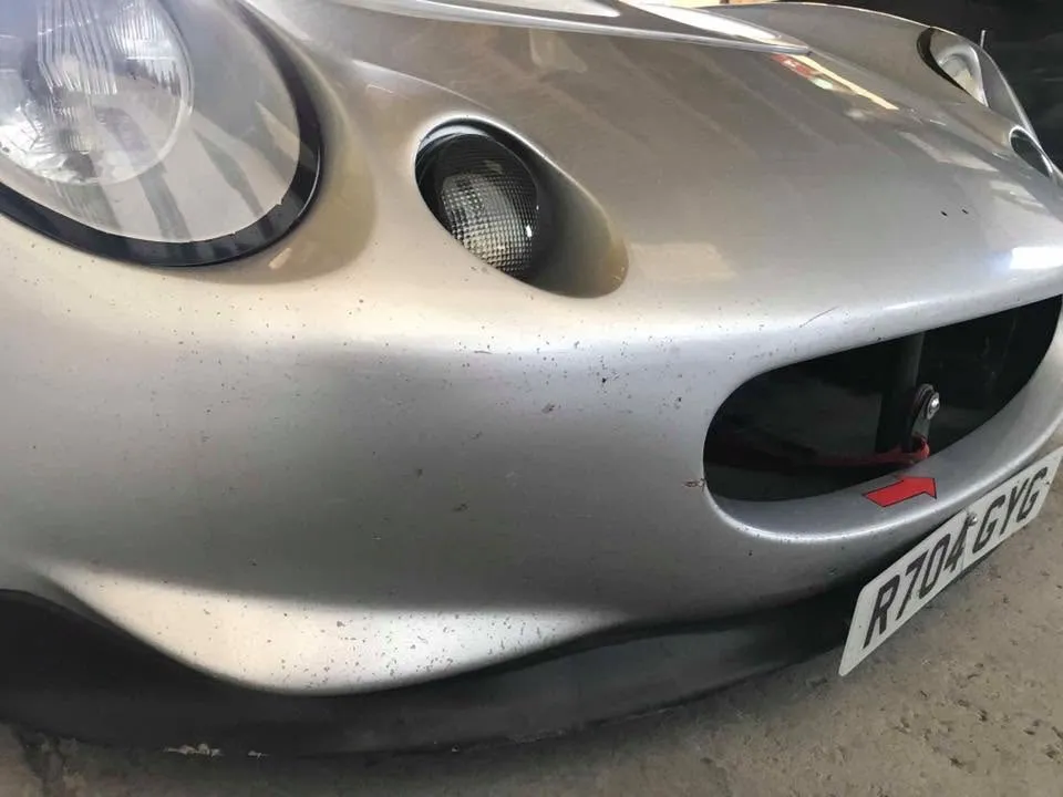 Lotus Elise with stone chips before refinishing at OH Works in Fairford